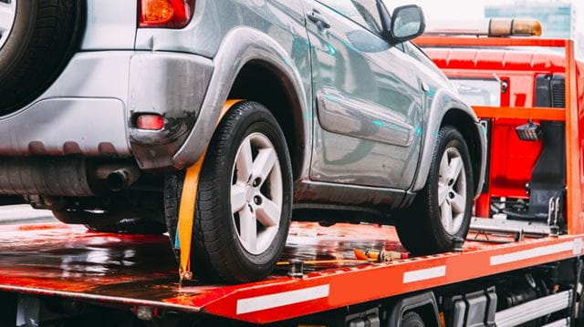 Broken down car on trailer
